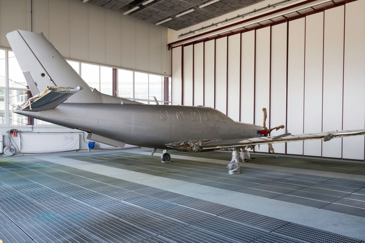 Business jet in a paint hangar